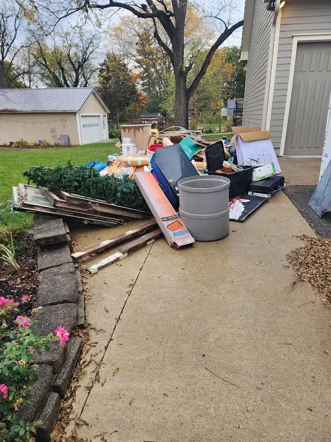 Dumpster being loaded with debris for 3 Yard Dumpster Rental in Quakertown